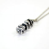 Silver necklace with delicate chain, metal pendant