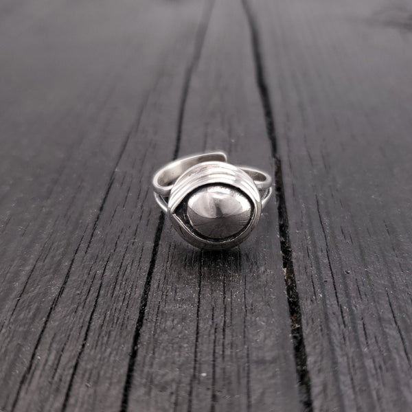 Cast it in solid sterling silver that has been hand oxidized it to a stunning finish. As you can see by the reflection in the convex surface, the eye sees all and is guaranteed to repel all evil directed towards its wearer.