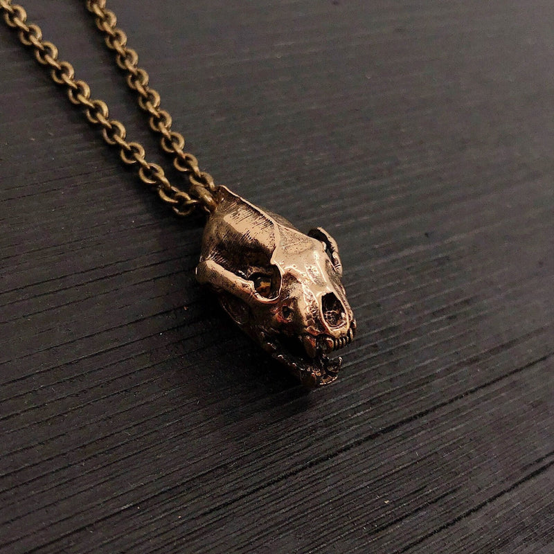 This 1&quot; bronze wolverine skull pendant exhibits exceptional realistic detail with the jaw slightly ajar.